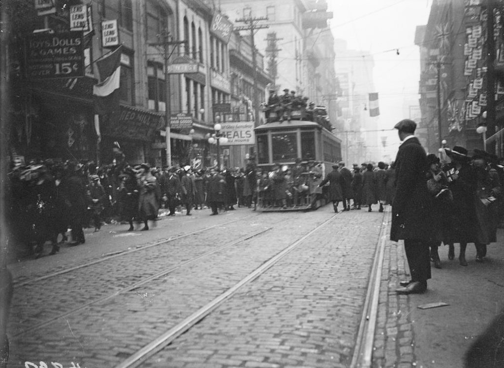 1918 - Armistice Day celebrations on Yonge St, looking south between Queen St and Shuter St