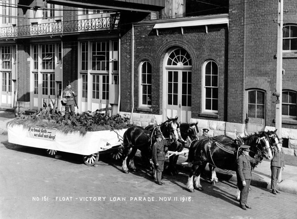 November 11, 1918 – Float representing "In Flanders Field" at Victory Loan Parade. Photograph taken at the Gooderham & Worts Distillery in Toronto