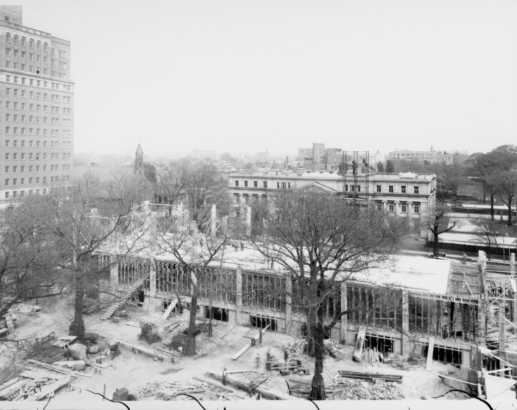1931 - Construction of ROM's East Wing, looking east towards Bloor St W and Queen's Park - notice the Park Plaza Hotel on the left and the Department of Household Science building behind the construction