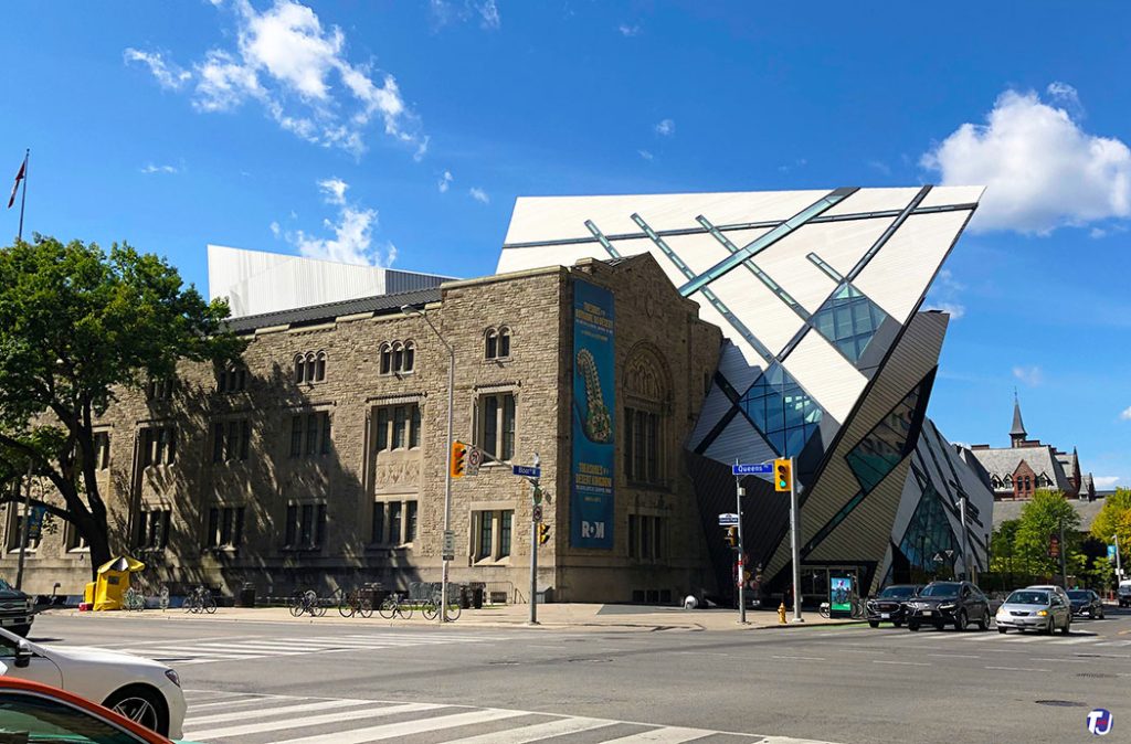 August 30, 2019 - ROM's north and east facade of the East Wing and the Michael Lee-Chin Crystal, looking southwest from Bloor St W and Avenue Rd