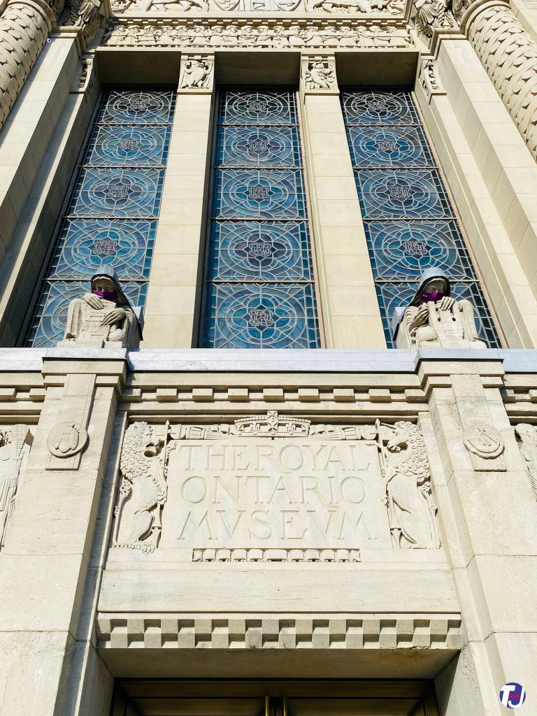August 15, 2020 - Stonework details, statues and stained glass over the Weston Entrance of the Royal Ontario Museum