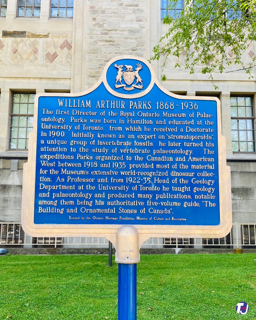 August 15, 2020 – The heritage plaque reads:
William Arthur Parks 1868 – 1936
"The first Director of the Royal Ontario Museum of Palaeontology, Parks was born in Hamilton and educated at the University of Toronto, from which he received a Doctorate in 1900. Initially known as an expert on "stromatoporoids", a unique group of invertebrate fossils, he later turned his attention to the study of vertebrate palaeontology. The expeditions Parks organized to the Canadian and American West between 1918 and 1935 provided most of the material for the Museum's extensive world-recognized dinosaur collection. As Professor and, from 1922-35, Head of the Geology Department at the University of Toronto he taught geology and palaeontology and produced many publications, notable among them being his authoritative five-volume guide, "The Building and Ornamental Stones of Canada"."
Erected by the Ontario Heritage Foundation, Ministry of Culture and Recreation
The plaque is located in front of the Royal Ontario Museum at 100 Queen's Park Cres