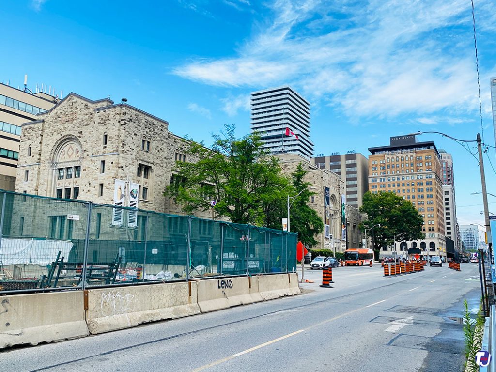 June 23, 2024 – – Looking northwest from Queen's Park and Charles St W towards Royal Ontario Museum in the left foreground and the Park Plaza, today the Park Hyatt in the distance